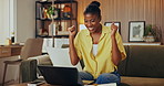 Happy, woman and fist pump in home with laptop, hiring offer or notification for remote work opportunity. Excited, black person and celebration with computer, job acceptance and freelance employment.