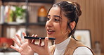 Remote work, woman and speaker phone in home to contact caterer, verify availability or voice memo. Freelancer, event planner and audio message in house for vendor follow up, planning process or chat