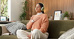 Meditation, breathing and woman with headphones in home for peace, calm and wellness podcast. Breathwork, audio and person in living room on sofa for mindfulness music, relax and zen for self care