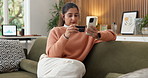 Woman, payment and credit card in home with phone, stock trading and check graphs to purchase shares. Person, digital banking and tech with online stats, wealth management and investment opportunity.