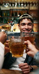Reunion, cheers and man in pub with drinks, friends celebration and good time on weekend. Social gathering, happy or people with beer toast, bonding party or get together in healthy relationship.