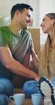 Relax, moving and coffee with couple in new home for property investment, discussion and renting. Kiss, real estate and homeowner with man and woman in living room for support, bonding and love