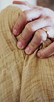 Home, hands and woman with shoulder pain, tired and joint injury with stress, muscle tension and fatigue. Closeup, apartment and person on sofa, inflammation and ache with bad posture or osteoporosis
