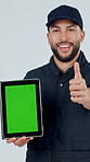 Face, tablet or delivery man with thumbs up or green screen in studio for advertising or marketing. Portrait, male person or courier guy pointing with technology or mockup space on a white background