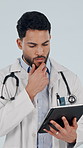 Thinking, doctor and reading in studio with tablet, research and contact patient for medical results. Thoughts, man and tech with ideas, schedule update and telehealth information on white background