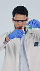 Beaker, pour and scientist in studio with chemicals, vaccine and experiment for lab study. Healthcare, pharmaceutical and man with sample, liquid and medical research for analysis on white background
