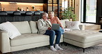 Couple, talking and laptop in home at smile, love and browsing website for bonding together. Happy, mature people and reading at house with pc, discussion and social media for weekend break in lounge