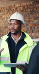 Discussion, man and construction worker on site with planning for renovation, repairs or project. Conversation, hardhat and male civil engineer with property development for house maintenance.