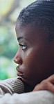 Thinking, sad and black woman in home with bad news, breakup or panic attack in living room. Mental health, depression and African female person with disappointment, frustration or overwhelmed.
