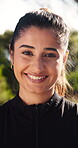 Smile, runner and face with woman in nature for health, happiness and workout break. Wellness, athlete training and fitness with female person outdoor for exercise commitment, self care and sports