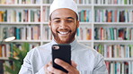 Muslim man, phone and smile with scholar in library for religious information or study. App, happy and Islamic person in bookstore for development or online research of Arabic culture and language