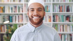 Face, Muslim man and smile with scholar in library for religious information or study. Confident, happy and Islamic person in bookstore for development or research of Arabic culture and language