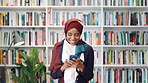 Student, laugh or Muslim woman in library with phone, college education or social media for funny joke. Islamic, black person or happy at university with tech, text message or meme for internet humor