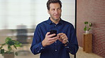 Creative, businessman and thinking with phone in office, smile or reading post with positive review. Digital marketing, brand strategist and person with mobile, scroll and happy with ad performance