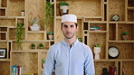 Muslim man, face and kufi at startup in office with pride, career and confidence at company. Islamic person, traditional hat and fez with religion, faith or job at creative agency in Saudi Arabia
