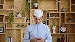 Muslim man, phone and texting at startup in office with smile, chat and notification at company. Islamic person, contact and fez with religion, mobile app or job with social media at creative agency