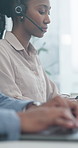 Woman, consultant and typing with headset in call center office for customer service or support. Female person, employee or agent working with technology for virtual assistance in contact agency