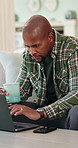 Coffee, laptop and black man in house with remote work for finance report with budget planning. Warm beverage, computer and African male financial manager with freelance career for investment in home