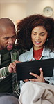 Couple, tablet and relax on sofa with smile, bonding and connection with movie choice in living room. African people, happy and tech on couch with streaming service, subscription or film in lounge