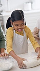Family, child and baking in home with dough, learning and culinary skills for homemade cookies. Mother, grandmother or teaching kid at house with pastry, kneading technique and supervision for treats