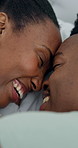 Embrace, happy and black couple in bedroom for morning, bonding and affection on weekend. Home, laugh and man with woman with forehead touch, care and love for connection, relationship and romance