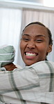 Black woman, bed and pillow fight in playful morning, wake up or bonding together in home. Happy person, POV and smile for weekend, holiday or break with cushion game and humor or excited in bedroom
