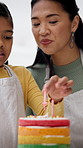 Baking, candles and mom with child with birthday cake, dessert and sweet treats for celebration. Family, home and mother with girl for help, bonding and happy with decoration, learning and prepare