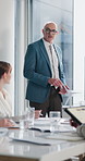 Businessman, presentation and speaking in office with wind turbine, clean energy and sustainability. Person, talk or pitch in workshop with tech, windmill electricity or eco friendly power generation