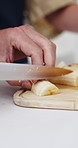 Hands, knife and fruit in kitchen with couple, cooking and preparation or ready for nutrition in home. Man, diet and banana for vegan meal with food, healthy snack or lunch for bonding and wellness