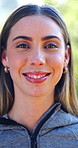 Face, athlete and woman in nature with smile, positive attitude and fitness for wellness. Portrait, female person and confident outdoor with runner, morning routine and sports training in America