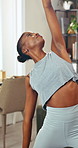 Fitness, yoga and black woman in home for wellness, health and self care in morning for calm. Relax, stretching and African female person with pilates exercise for balance in living room at house.