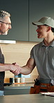 Man, plumber and handshake with customer in kitchen for deal, consultation or home repair. Male people, handyman or shaking hands with client, checklist or fix for invoice, quote or plumbing service
