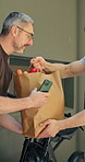 Delivery man, groceries and happy with bike at front door, customer and ecommerce order. Mature person, courier and bicycle with paper bag, digital app or service with sustainable transport and home
