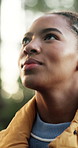 Happy, hiking or black woman with vision in nature for outdoor adventure, travel or sightseeing. Active, female person or hiker with smile or view in forest for trekking journey or trip in wilderness