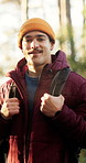 Face, man and breathe with hike in woods for fresh air, explore and adventure on holiday or travel. Outdoor, happy hiker and portrait for backpacking on vacation, journey or wellness in forest nature