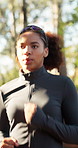 Breathing, fitness and running with woman outdoor in nature for exercise or training routine. Cardio, group and workout with runner in forest for commitment or dedication to physical activity