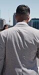 Business, back or man in city with commuting, pedestrian walk or morning travel in work routine. Corporate, trip or male person in town with route, employee journey or urban stroll at start of day.