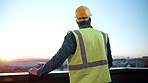 Back, thinking and engineer on balcony for construction, inspection and planning for architecture. Space, man or hardhat on terrace for reflection, urban view and quality control for building project