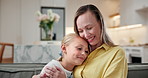 Hug, girl and smile with mother in home for care, support or connection in lounge on sofa. Child, daughter and embrace with woman in living room for family bonding, love and security in house