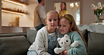Comfort, kids and hug with parents fighting, argument and care with teddy bear in home. Sister, stuffed animal or sad children embrace for emotional support, protection or safety from family conflict