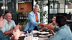 B2B, applause or people in firm with handshake, funding approval or deal celebration in meeting. Happy, clap or finance analyst with shaking hands, investment success or achievement in partnership.
