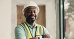 Civil engineer, face and happy man with arms crossed on construction site, real estate or renovation. Mature architect, portrait and black person with helmet, smile and property management in Nigeria