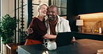 Hug, laptop and couple in home with credit card, online purchase and payment for booking holiday. Mature, happy and people on computer for travel discount, trip and embrace for interracial marriage