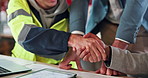 Architect, people and project with handshake for construction partnership or teamwork in office. Meeting, civil engineer or shaking hands with group for architecture deal, building or agreement