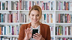 Professor, typing and happy woman with phone in library for academic study, knowledge or information. Female person, teacher or scrolling with smile on smartphone for online curriculum or syllabus