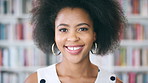 Black woman, happy and student with face for education at college by bookshelf, confident and library at campus. Girl, smile and portrait for learning, scholarship or study at university in Nigeria