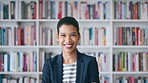 Woman, happy and college student with face for education at arms crossed by bookshelf at campus library. Girl, smile and portrait for learning, scholarship or confident at university in Costa Rica