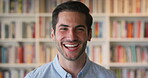 Face, friendly and funny with man in library as college or university professor for education. Future, learning and satisfaction with teacher laughing in bookstore for academic job or research