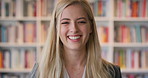 Woman, face and student in library with smile at college by bookshelf, education or confident at campus. Girl, happy and portrait for learning, academic research or project at university in Australia