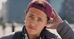 Cap, city and face of teen student outdoor for morning commute to high school campus. Education, hat and windy with person in urban town for development, learning opportunity or travel as scholar